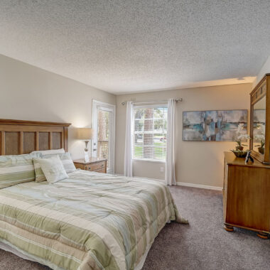 Large Primary Bedroom with Plush Carpet